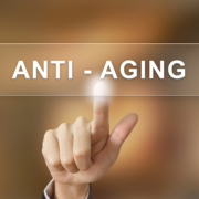 business hand clicking anti aging button on blurred background